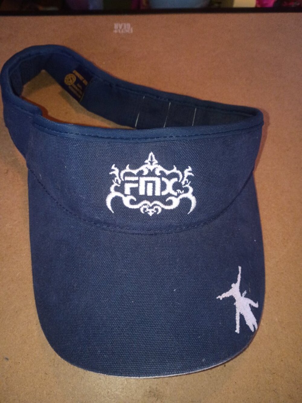 navy blue sun visor featuring the FMX (Freestyle Motocross) embroidered branding